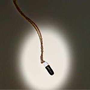 Black large chill pill necklace